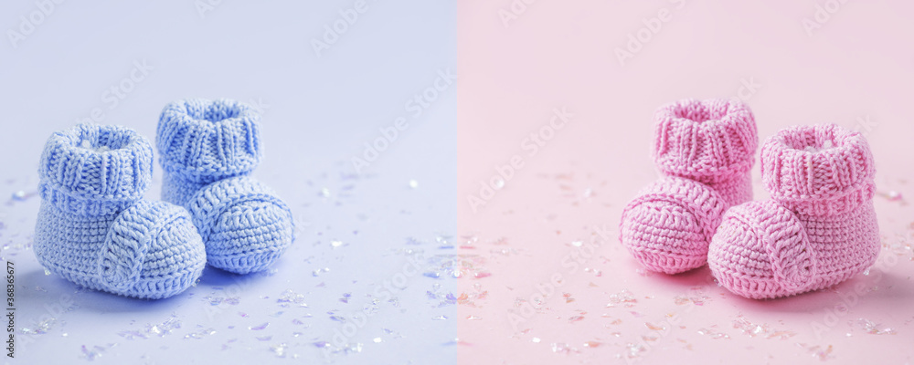 Pair of baby booties, shoes on the blue and pink background, cozy conceptual idea. Guess gender of the child, baby shower party. Preparation and choice of color for newborn baby room