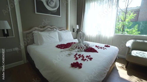 Honey moon bed.towel swans shaped on the bed photo