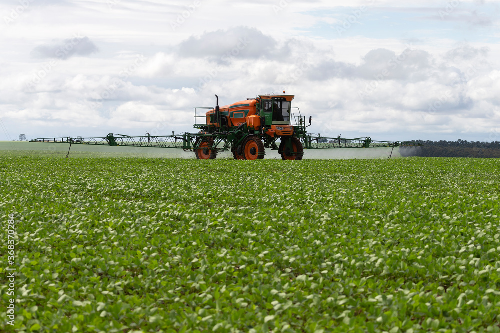 Agricultural irrigation truck tractor spraying pesticides Agricultural irrigation truck tractor spraying pesticides