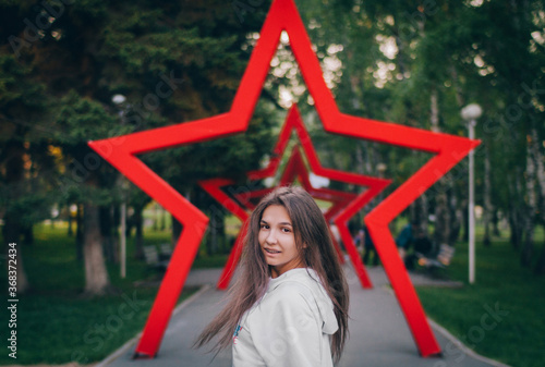 Young girl in oversize walking in city's park