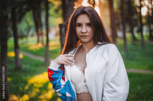 Young girl in oversize walking in city's park