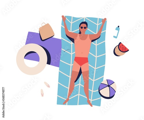 Top view sunbathing man with bad tanning, lying on beach blanket in swimsuit....