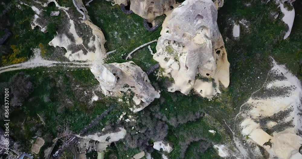 Aerial opening drone shot of Capadoccia fields and town with famous pike Aerial opening drone shot of Capadoccia fields and town with famous pike