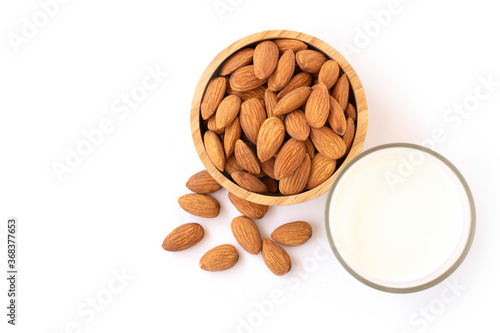 bowl of almonds with almond milk isolated on white.