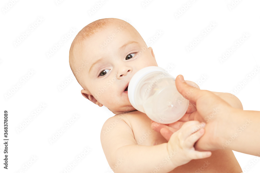 Little pretty kid. Lying at home. White background. Eat milk. Male child portrait. Mother care. Funny sensitive human. Horizontal banner with copyspace. Look at side. Drink water Little pretty kid. Lying at home. White background. Eat milk. Male child portrait. Mother care. Funny sensitive human. Horizontal banner with copyspace. Look at side. Drink water