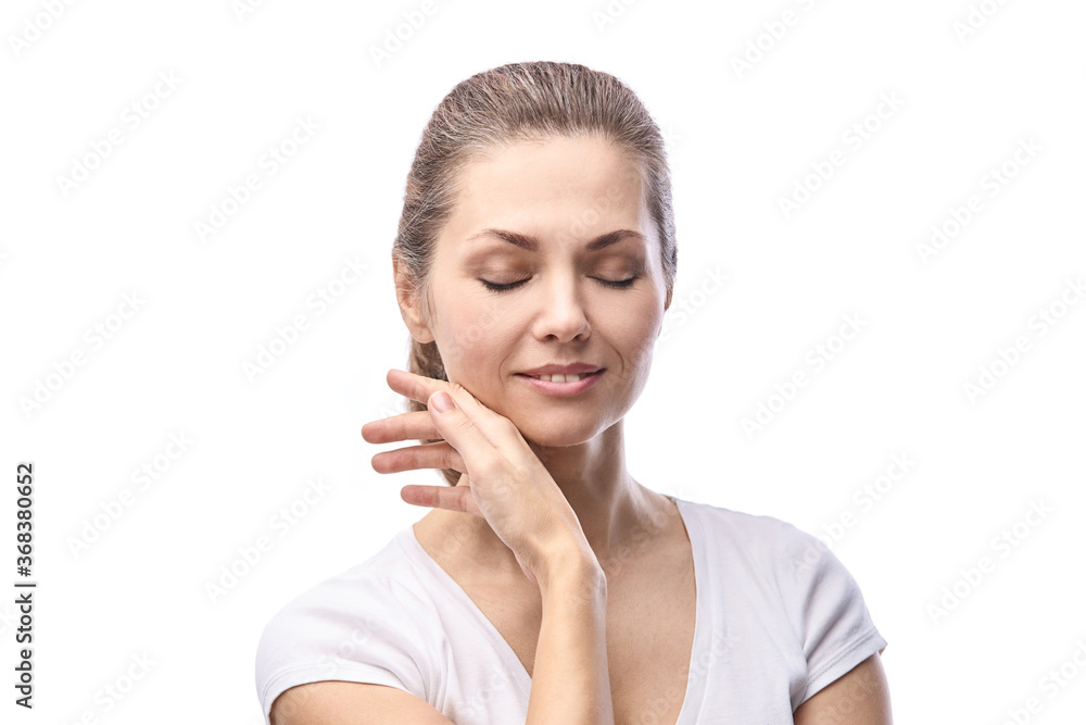 Happy pretty woman. Hands near face. Skincare concept. Home morning routine. Clean skin. Cream cosmetics. Cosmetology therapy. Rejuvenation procedure. White background. Copyspace Happy pretty woman. Hands near face. Skincare concept. Home morning routine. Clean skin. Cream cosmetics. Cosmetology therapy. Rejuvenation procedure. White background. Copyspace
