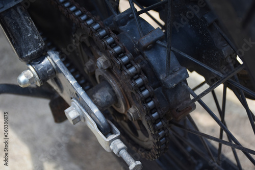 close up of the chain on the wheel of a car