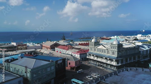 Aerial panorama over the city intersection with cars and yachts on the horizon in Bridgetown, Barbado