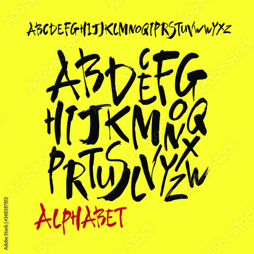 Vector Acrylic Brush Style Hand Drawn Alphabet Font. Calligraphy alphabet on a yellow background. Ink hand lettering.