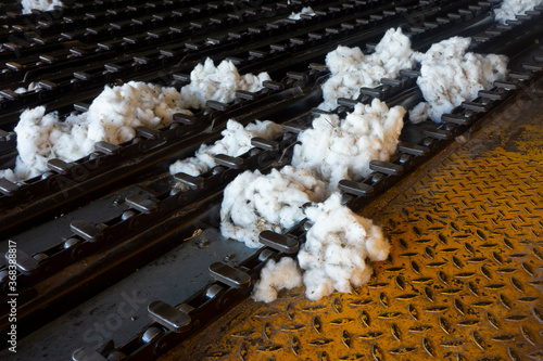 Waste raw cotton in the machinery at the gin.