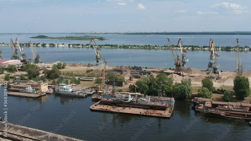 A boat is docked next to a body of water A boat is docked next to a body of water