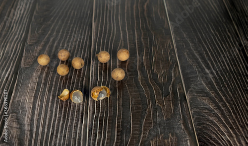 longan lay on a wooden background.