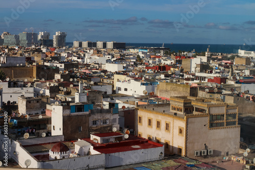 Fototapeta Naklejka Na Ścianę i Meble -  Top view of the rooftops of Casablanca and the Atlantic ocean.