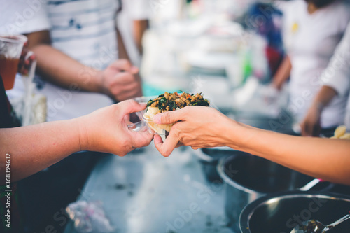 Volunteers Share Food to the Poor to Relieve Hunger : Charity food concept