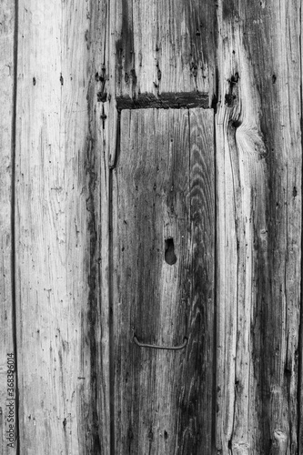 evocative black and white image of texture of old vertical wooden planks