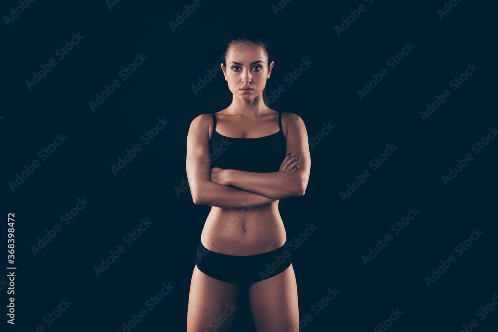 Obraz premium Portrait of her she nice-looking attractive adorable sportive strong lady perfection form figure folded arms physical energy life style isolated over black background