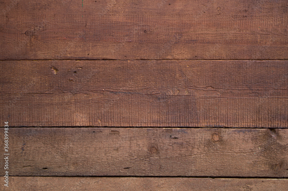 The texture of wood planks covered with stain The texture of wood planks covered with stain