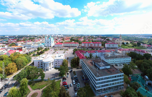 St. Francis Xavier Cathedral And Traffic In Mostowaja And Kirova Streets in the morning light. Grodno city in Belarus. Aerial view from a drone.