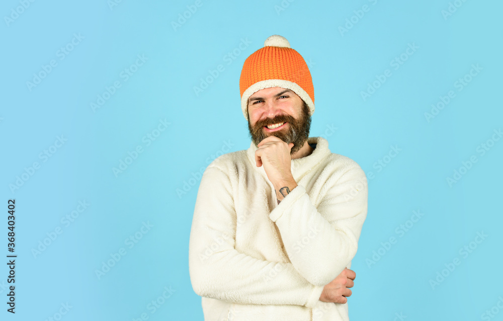 Hipster style. Head in warm hat. Mature emotional hipster funny style accessory. Bearded hipster. Handsome man knitted hat with pom pom. Fashion concept. Winter clothes and accessories. Feeling good Hipster style. Head in warm hat. Mature emotional hipster funny style accessory. Bearded hipster. Handsome man knitted hat with pom pom. Fashion concept. Winter clothes and accessories. Feeling good
