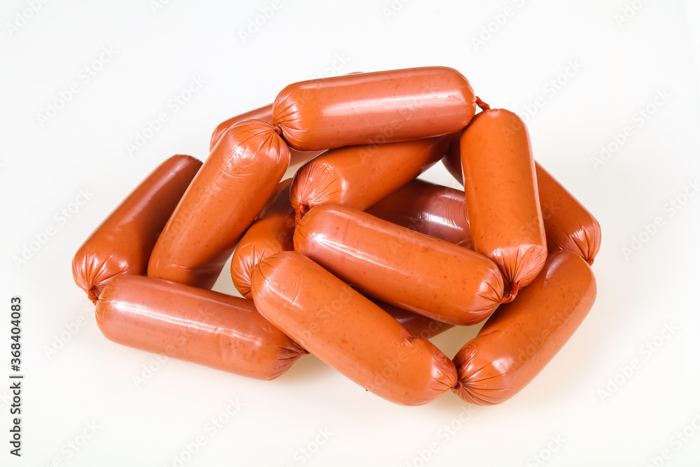 Tasty meat sausages over white background