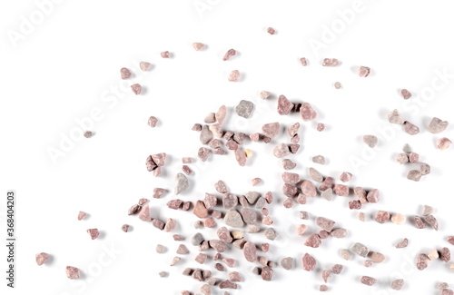 Colorful decorative rocks, pebbles, stones pile isolated on white background, top view