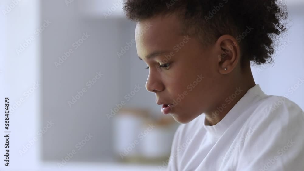 sad boy facial emotion Spbi. portrait of worried nervous mixed race child teenager. puberty, adolescence concept. serious little unhappy guy. boredom, innocence, emotion concept sad boy facial emotion Spbi. portrait of worried nervous mixed race child teenager. puberty, adolescence concept. serious little unhappy guy. boredom, innocence, emotion concept