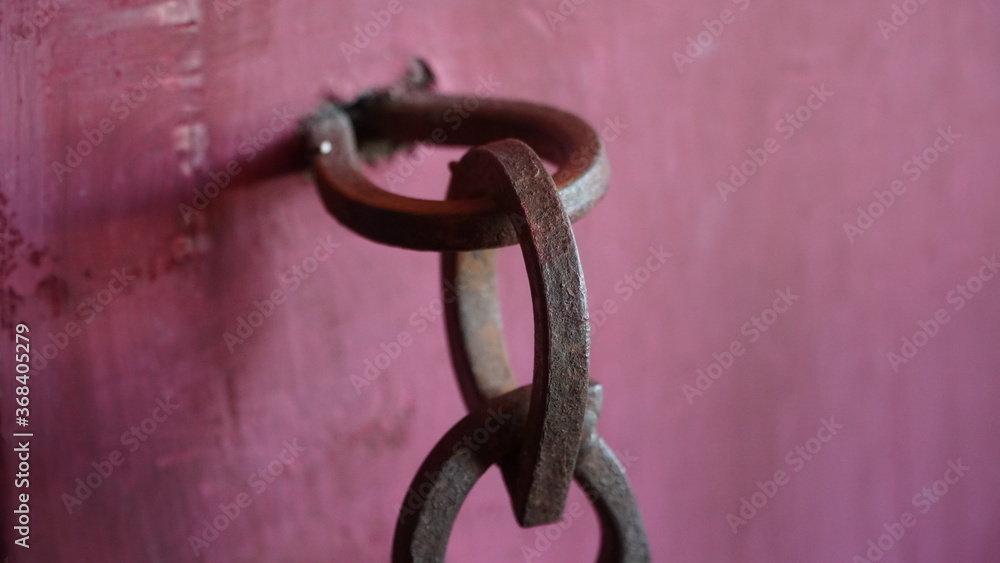 Old rusty iron ring close up image with a solid iron ring to secure on the old door and surface Old rusty iron ring close up image with a solid iron ring to secure on the old door and surface