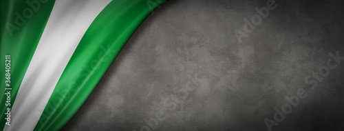 Photos Nigerian flag on concrete wall banner