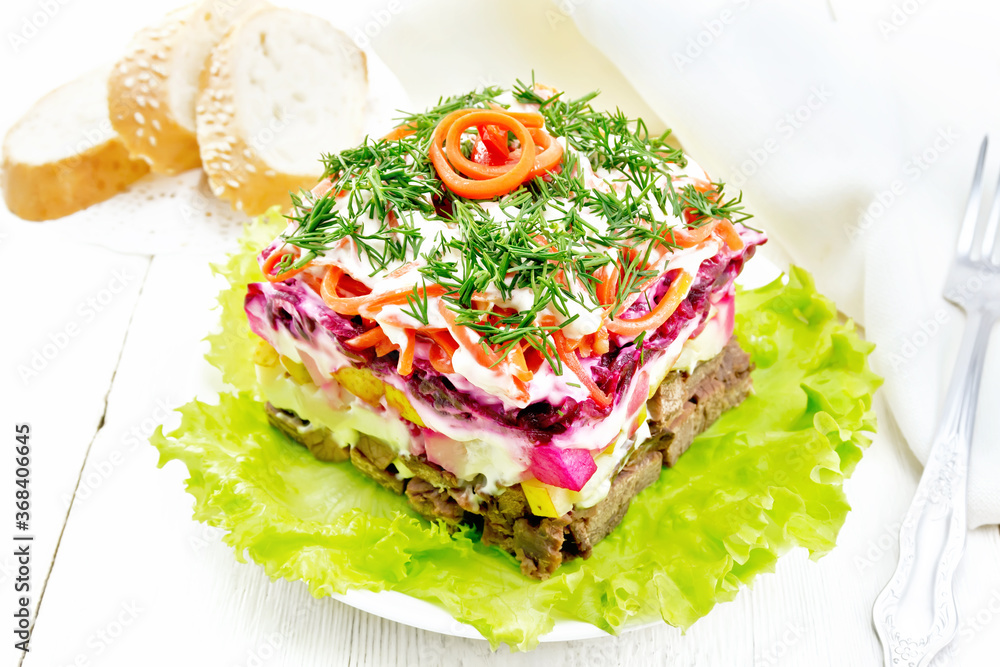 Salad with beef and vegetables on board