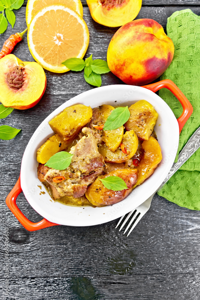 Turkey with peaches in pan on board top Turkey with peaches in pan on board top