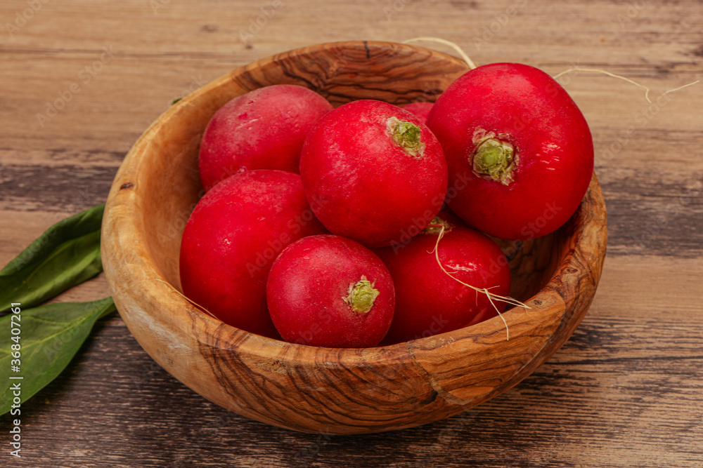 Ripe fresh radish heap over wooden Ripe fresh radish heap over wooden