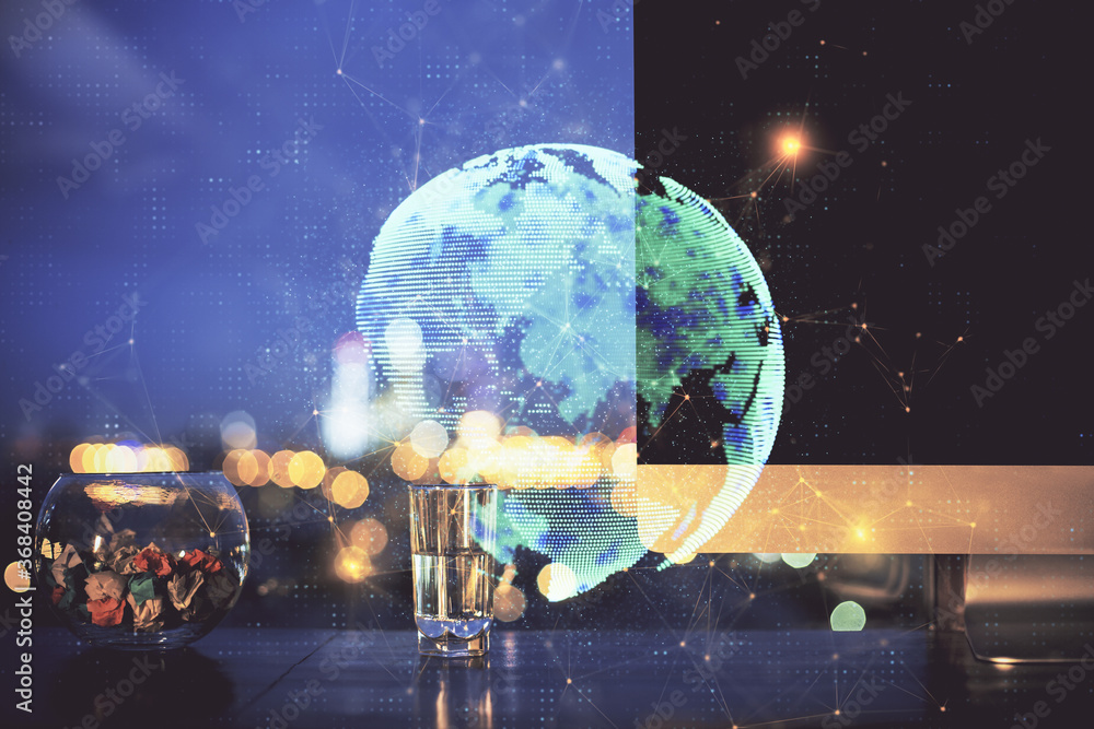Fototapeta premium Computer on desktop with social network hologram. Double exposure. Concept of international people connections.