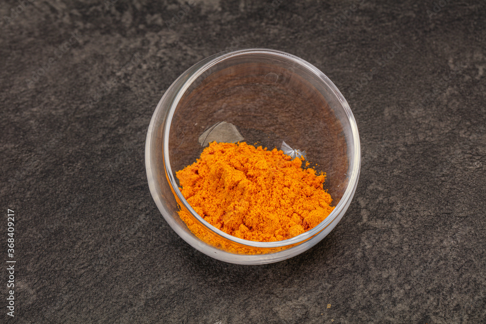 Tumeric powder in the bowl Tumeric powder in the bowl