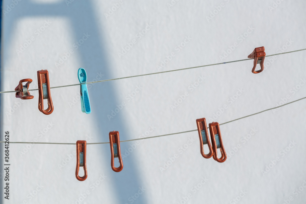 Fototapeta premium red pegs with shadows on a white background