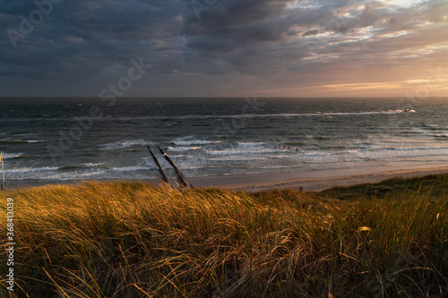 Photograph at the beach and dunes moments before the sun sets in the southwest of the Netherlands. 