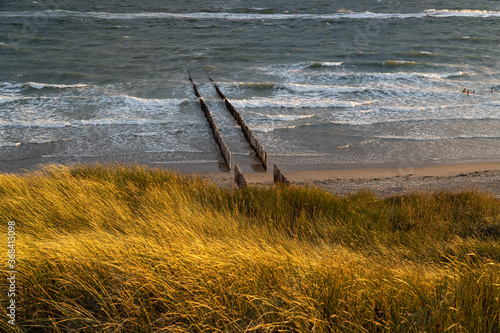 Photograph at the beach and dunes moments before the sun sets in the southwest of the Netherlands. 