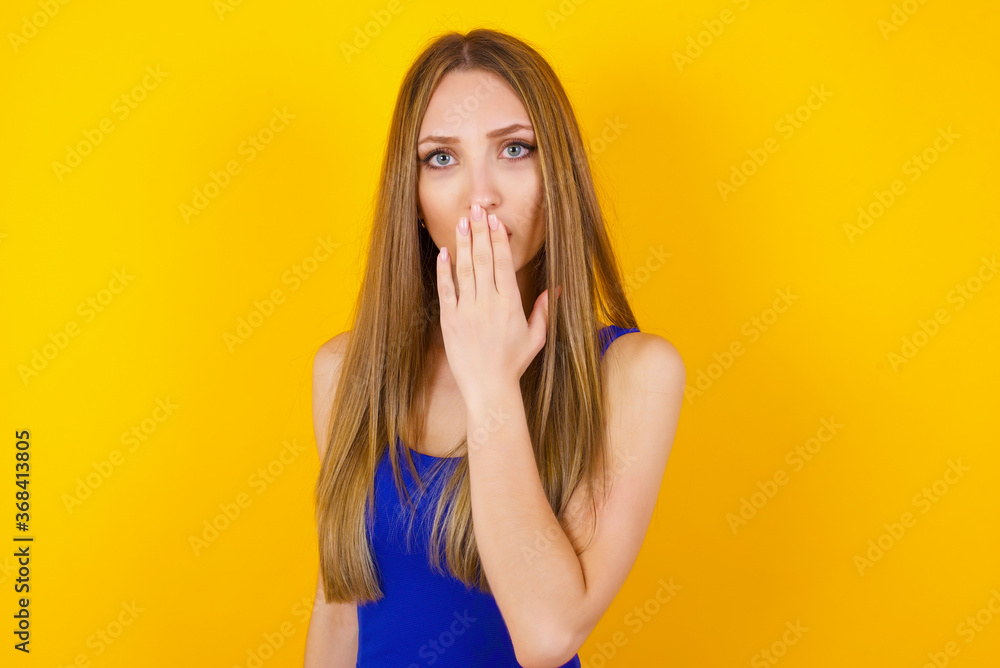 Oh! I think I said it! Close up portrait of lady cover open mouth by hand palm, look at camera with big eyes. Oh! I think I said it! Close up portrait of lady cover open mouth by hand palm, look at camera with big eyes.