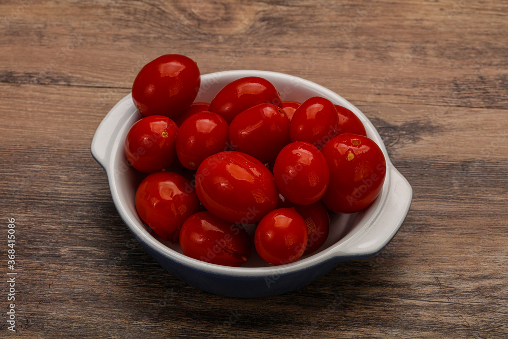 Pickled cherry tomatoes in the bowl Pickled cherry tomatoes in the bowl