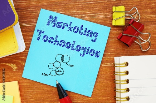 Business concept meaning Marketing Technologies with sign on the piece of paper.