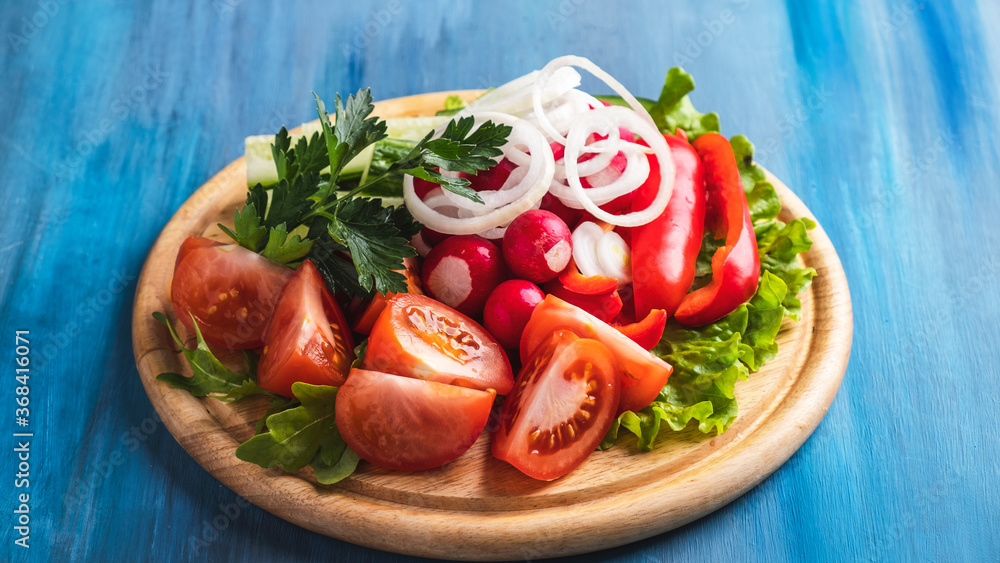 Varios of vegetables on a board . Cold snack Varios of vegetables on a board . Cold snack