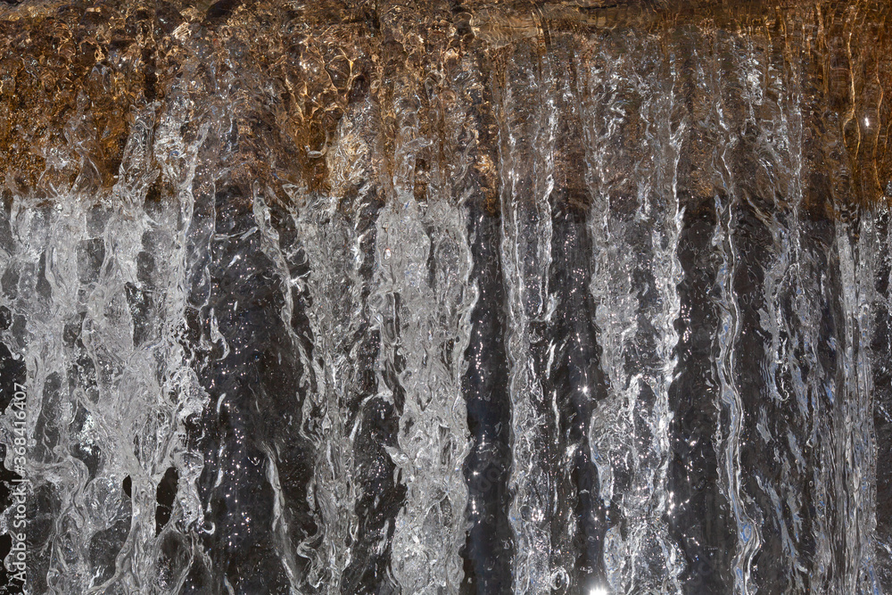 City river waterfall , side view of the falling water flow City river waterfall , side view of the falling water flow
