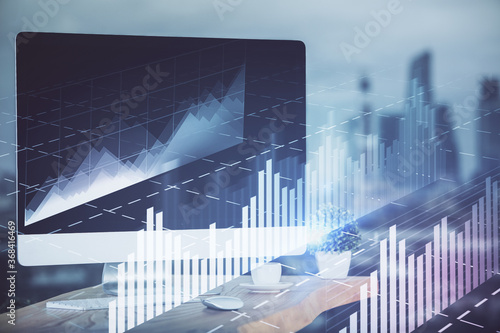 Stock market graph and table with computer background. Double exposure. Concept of financial analysis. © peshkova