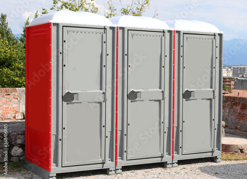 portable toilets booths installed in a public park in the city a photo