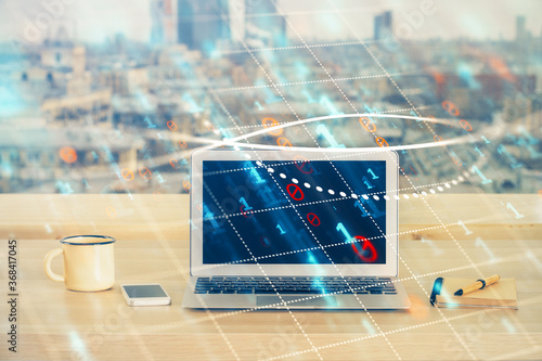 Financial graph colorful drawing and table with computer on background. Double exposure. Concept of international markets.