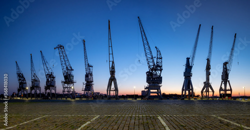 Old harbor cranes in the city of Antwerp.