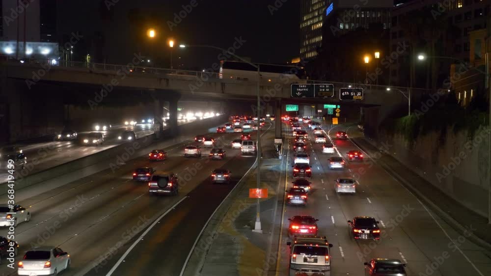 Traffic jam in Los Angeles at night in 4k slow motion 60fps Traffic jam in Los Angeles at night in 4k slow motion 60fps