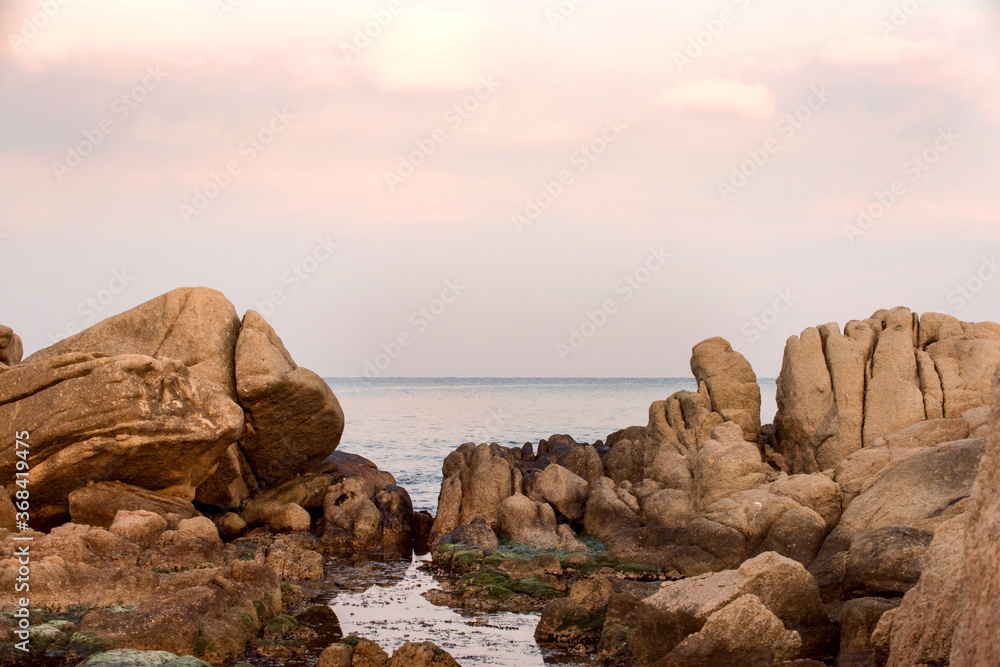 Beautiful rock and waves on the seashore along the coastline.