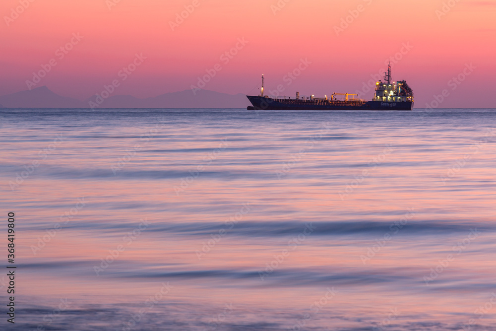 sunset with yachts on santorini island