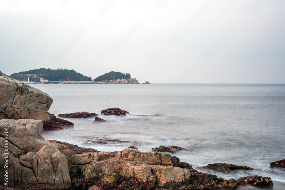 Beautiful rock and waves on the seashore along the coastline.