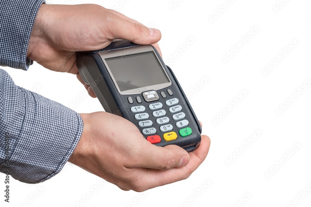 Payment terminal in hand of man isolated on white Payment terminal in hand of man isolated on white